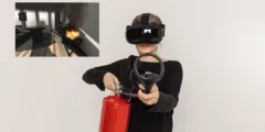 Frau mit VR-Helm und VR-Feuerlöscher